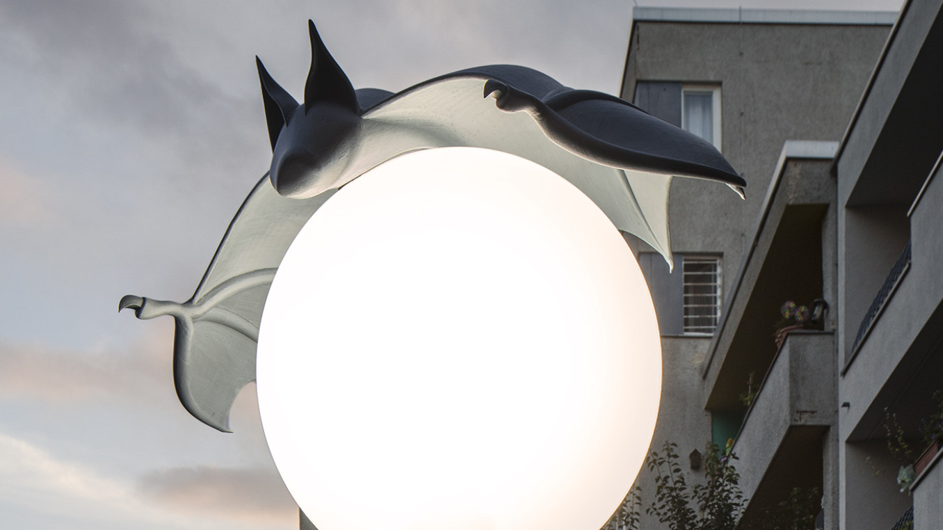 Nightcaps: Bat hovering over street lantern, Alona Rodeh