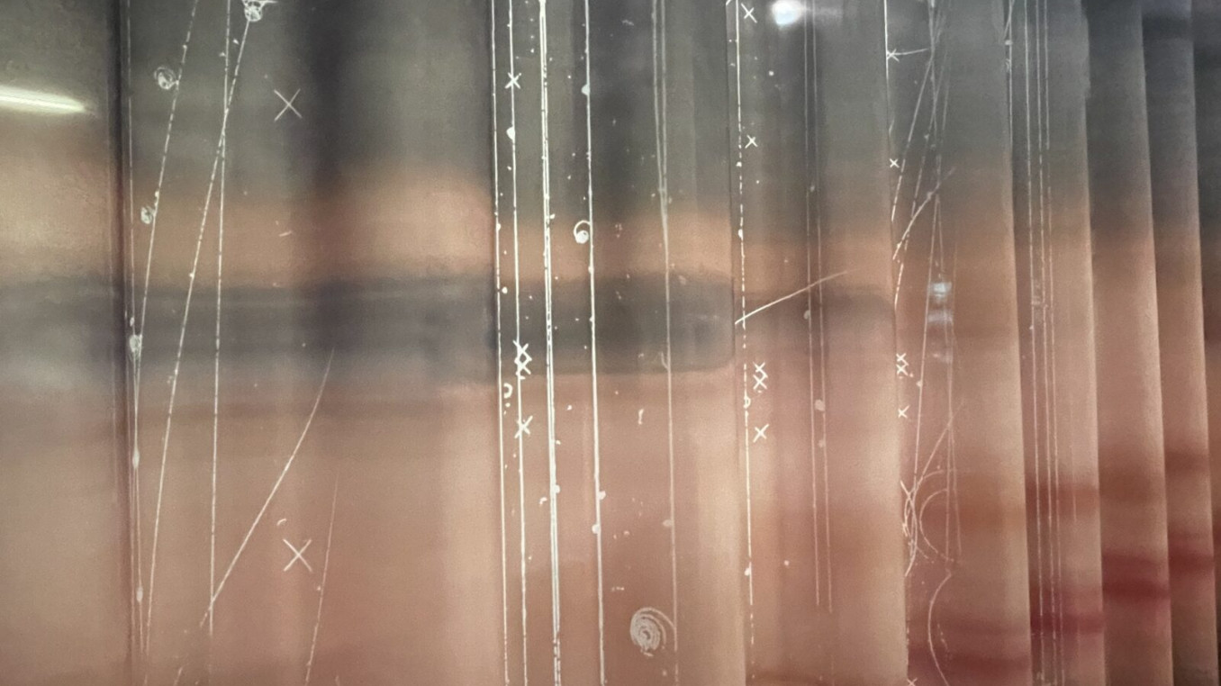 Artistic image of repeated parts of photograph of woman's face