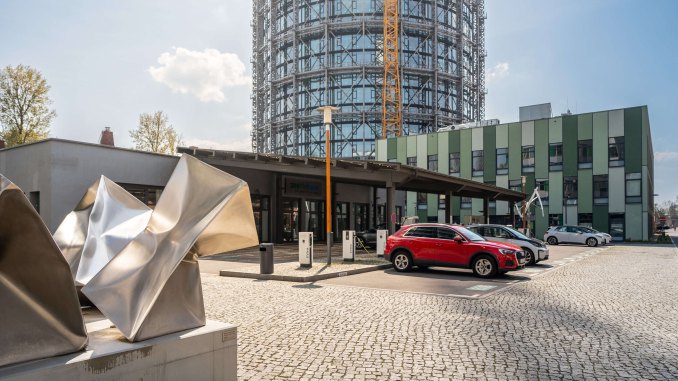 Photo of car park and entrance to zeemobase with abstract statue