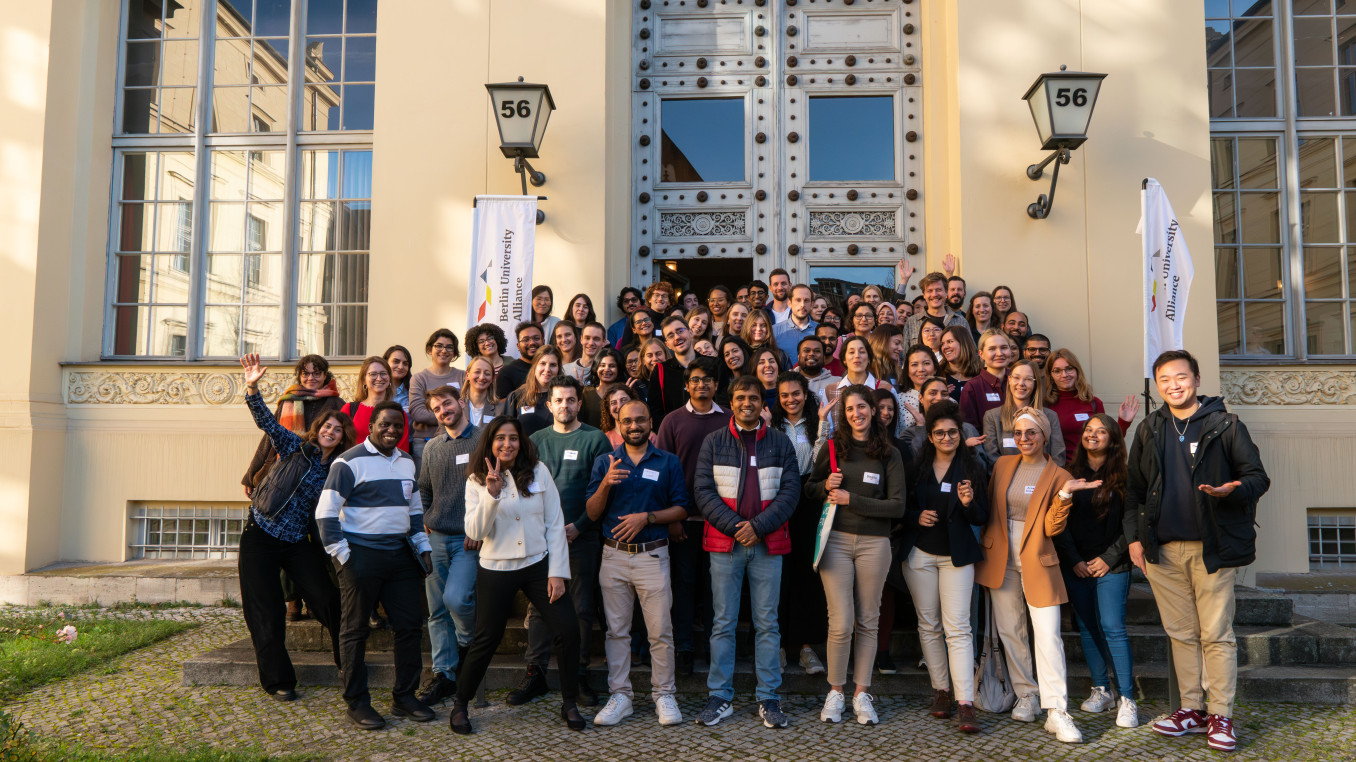 Group photo of Berlin Postdoc Day 2025 participants in front of the entrance of Humboldt Graduate School building