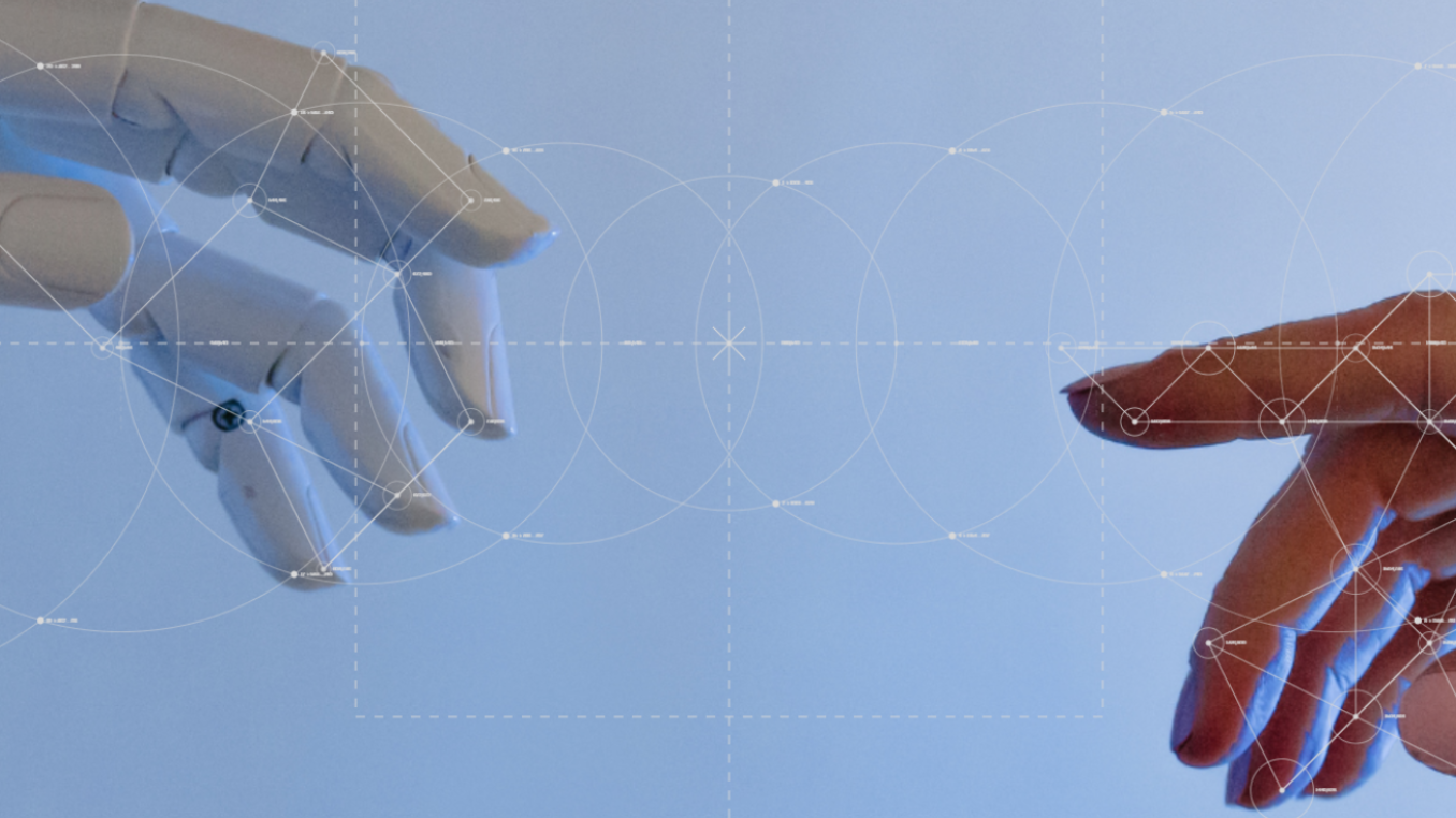 Menschliche Hand und Roboterhand