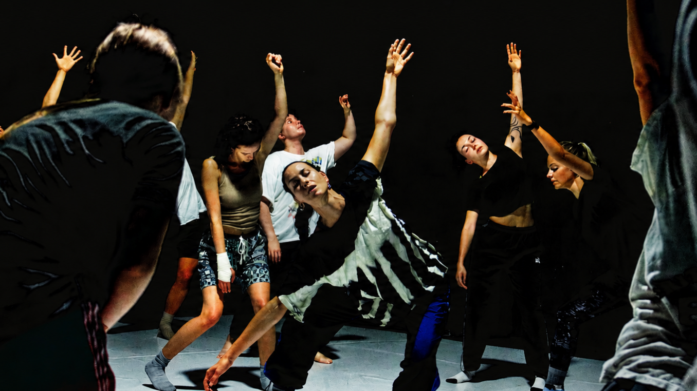 People dancing with arms outstretched